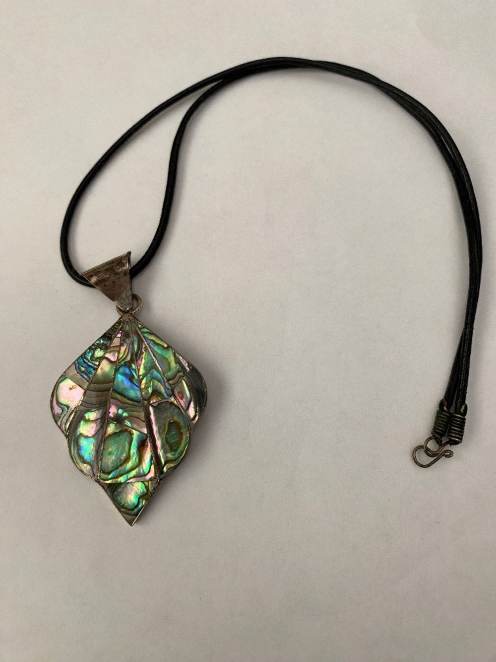 Abalone & alpaca silver pendant from Mexico, with a leather cord.